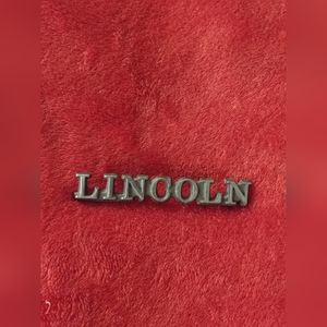 Lincoln metal emblem